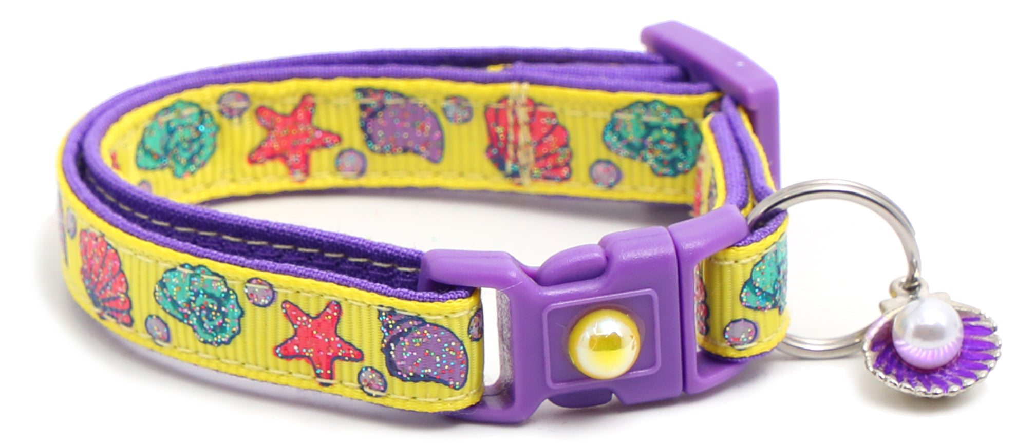 Beachcomber Breakaway Cat Collar in vibrant colors, featuring a breakaway clip and removable bell, made from soft reinforced cotton.
